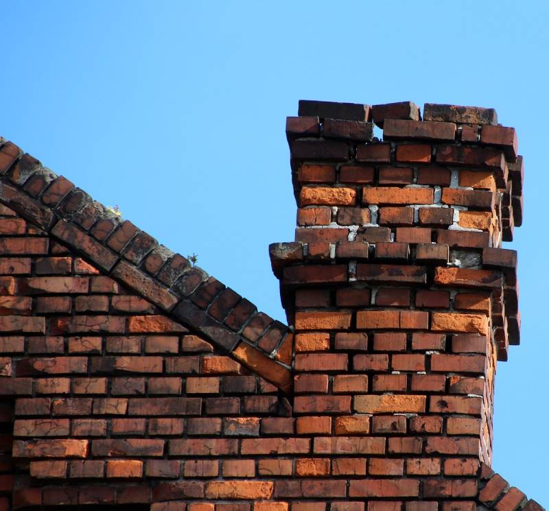 Signs Your Agoura Hills Home Needs a Chimney Inspection Damaged chimney on an Agoura Hills home showing cracks and missing mortar